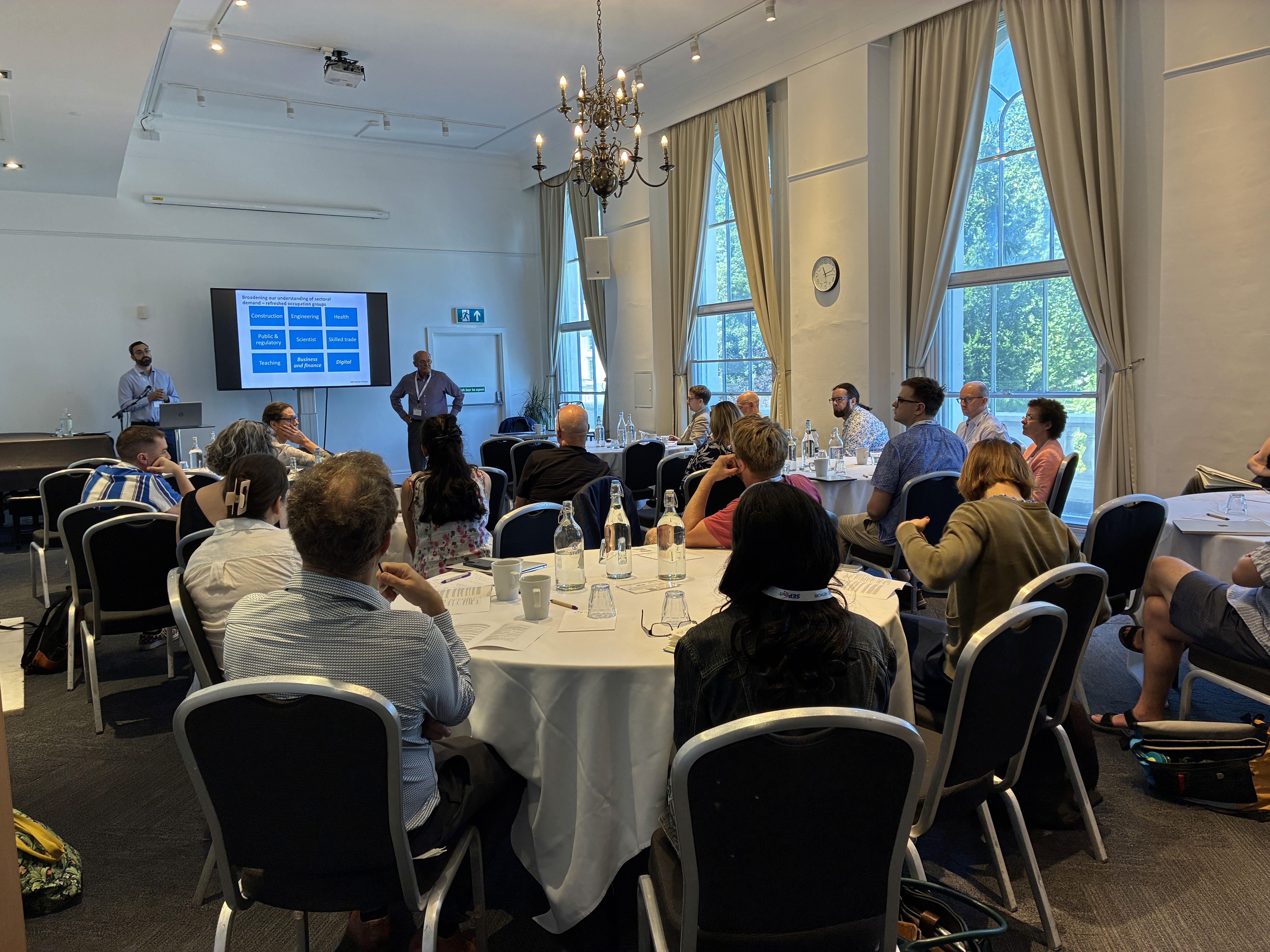 A group shot of the room showing the atendees
