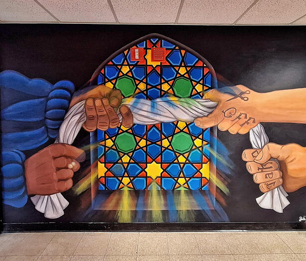 Oposing sides with different arms pulling on a piece of clothing (hijab). 