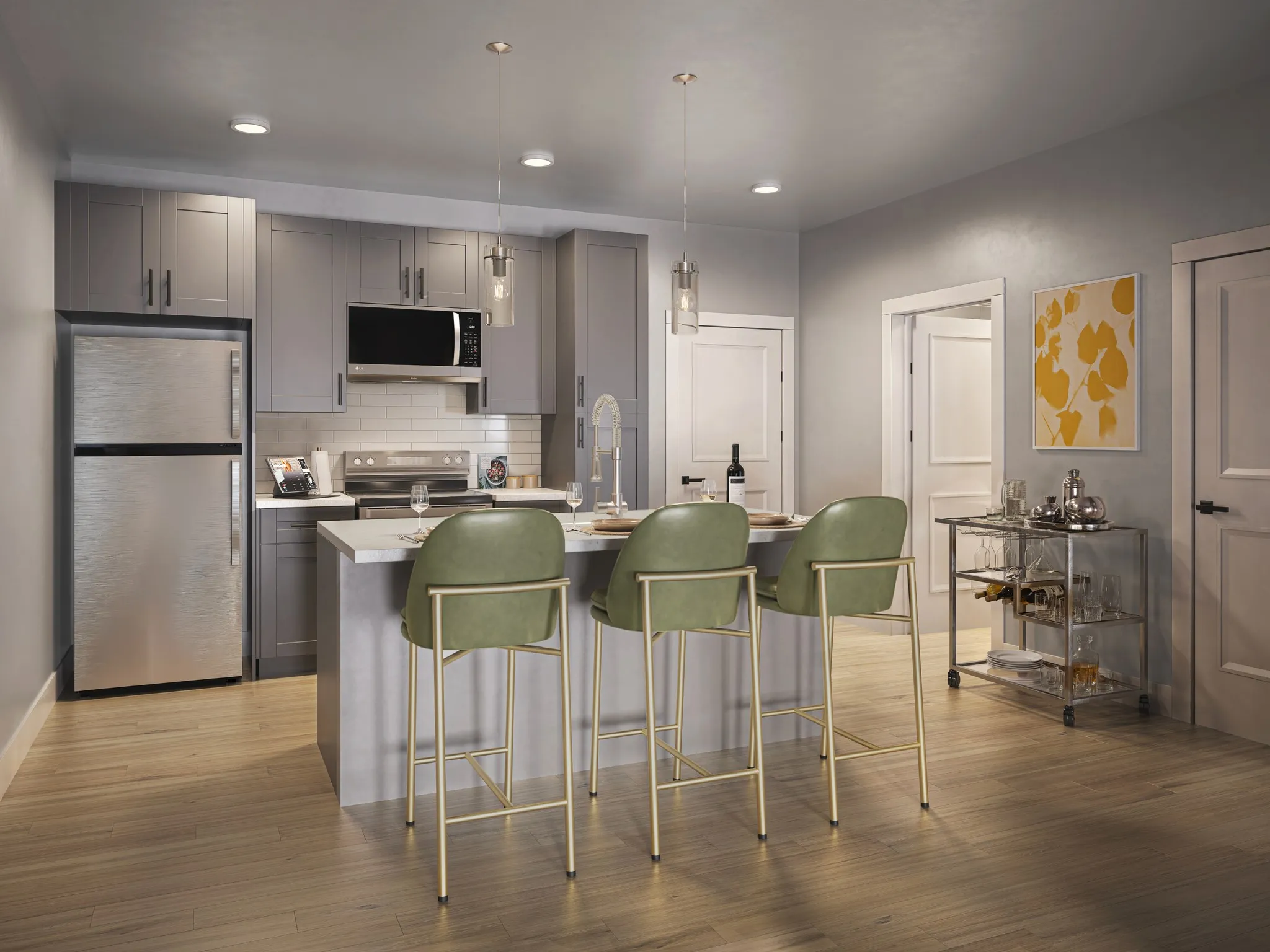 A modern kitchen featuring a bar with stools, creating a casual dining space.