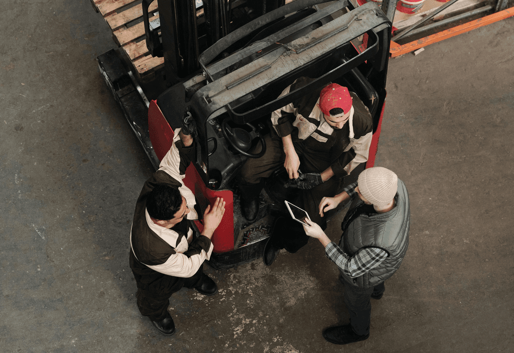 Young woman in construction uniform holding a tool