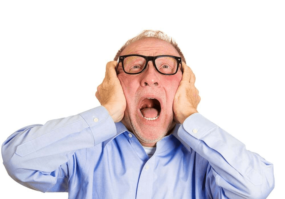 Person with glasses and a blue shirt talking on the phone.
