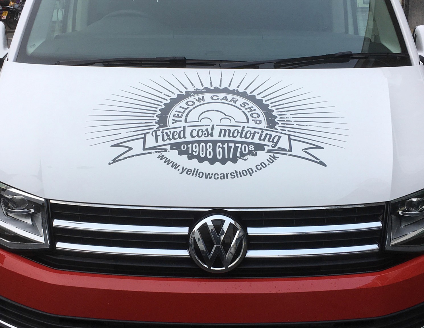 Vehicle graphic designed around a company logo