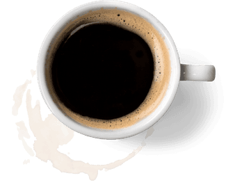 a cup of coffee that has left a ring on the desk