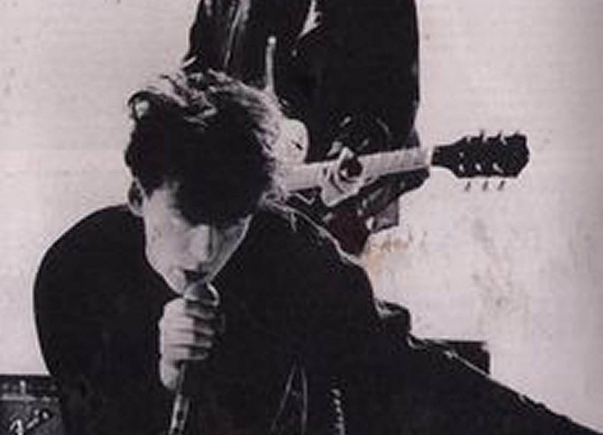 Silhouette of a woman against a dark brown silk background