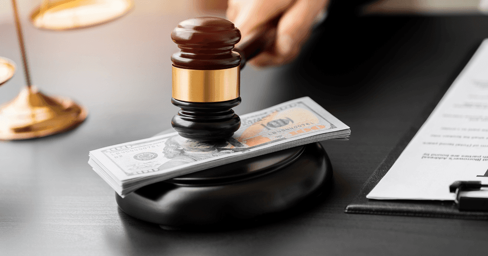 Gavel hitting down on a stack of bills