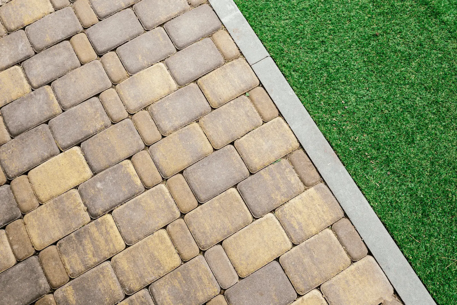crisp power edged lawn against brick walking path
