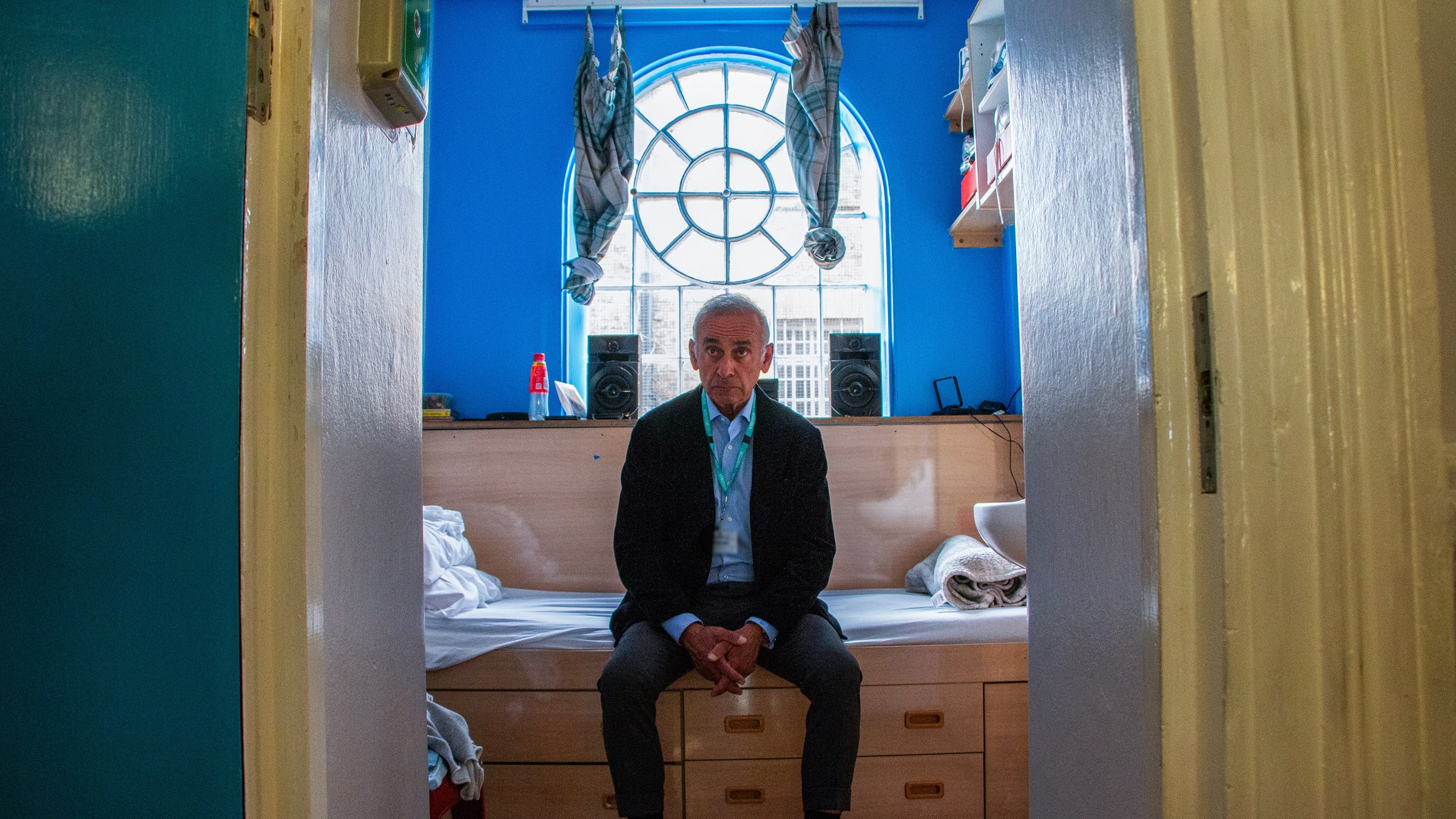 Lord Darzi sitting on a bed in a secure mental health facility
