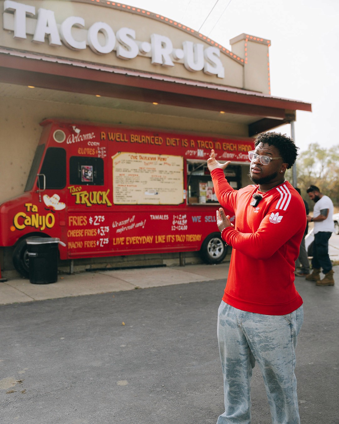 A single white daisy with a yellow center is positioned against a blue background. Behind it, bold text reads "BLOSSOM" with words "New Beginnings," "Simplicity," and "Purity" below. The design conveys freshness and hope.