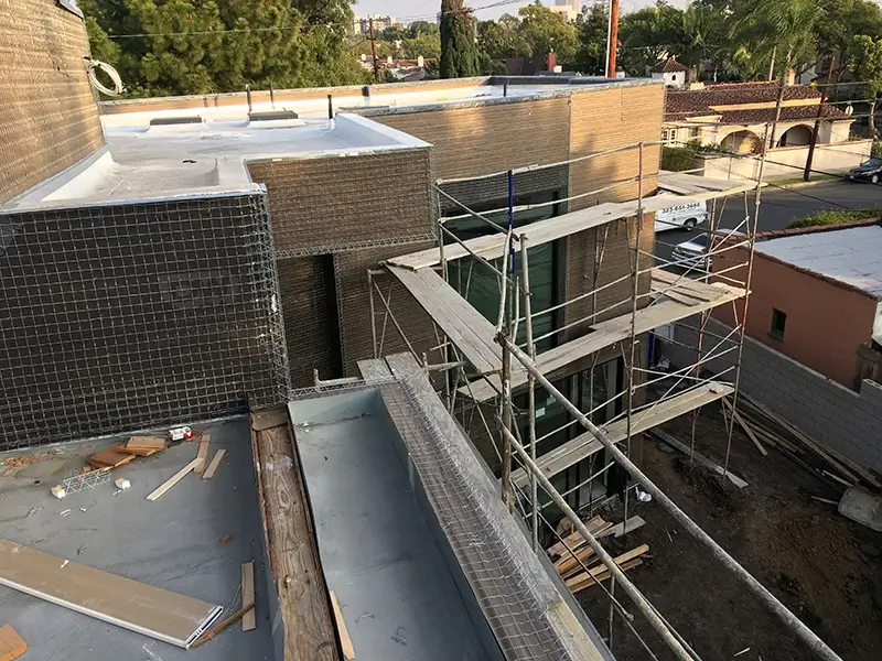 black laptop computer on white table
