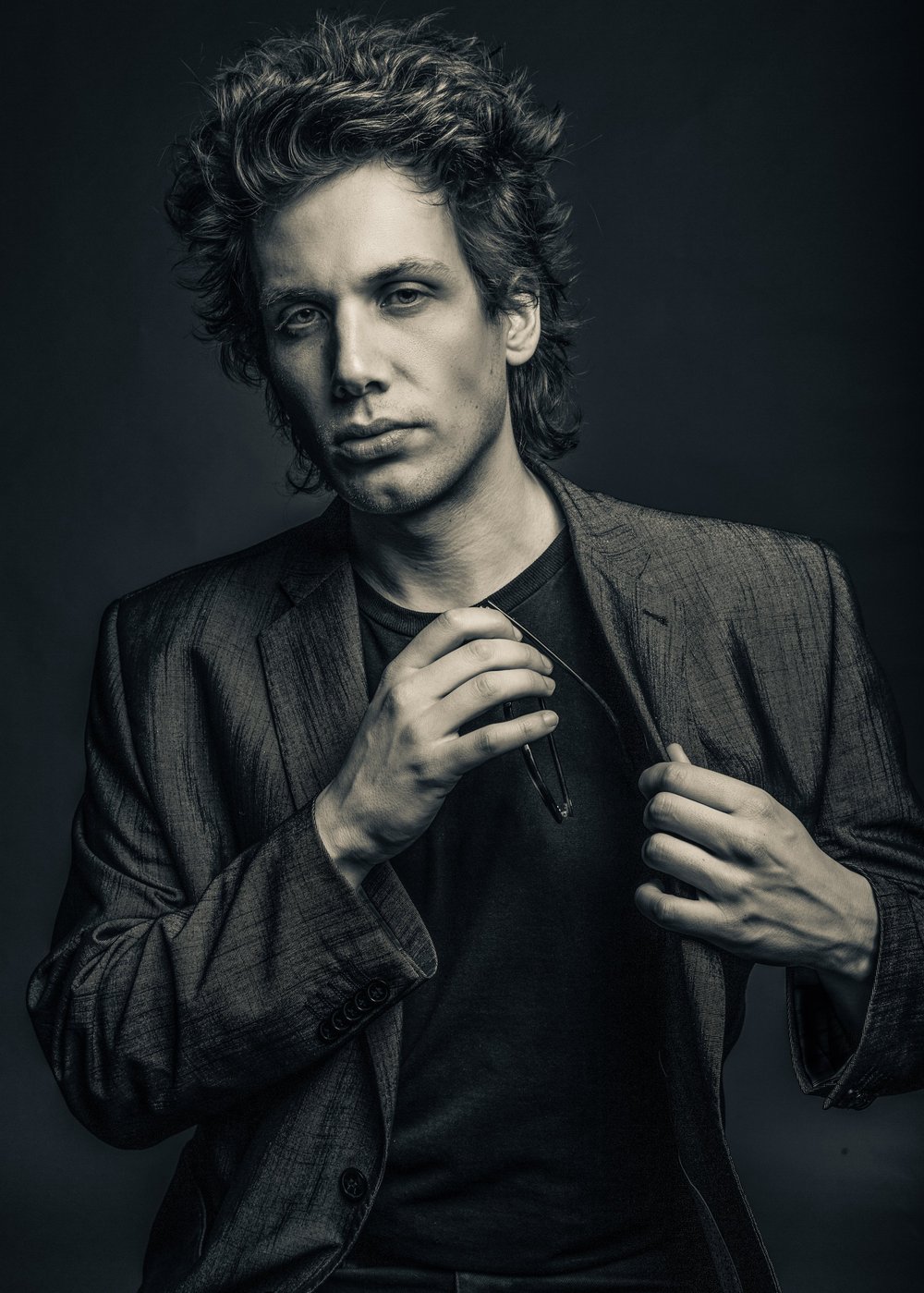 Studio portrait against painted canvas