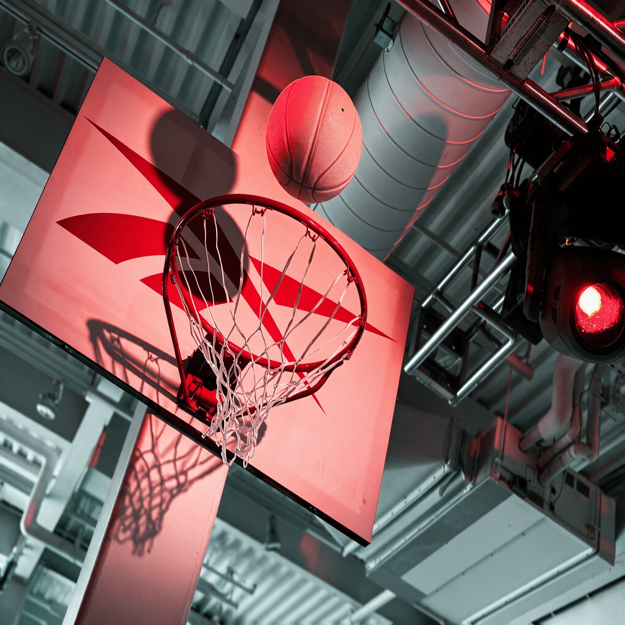 Dramatic basketball hoop lighting installation at Reebok's Brand Summit