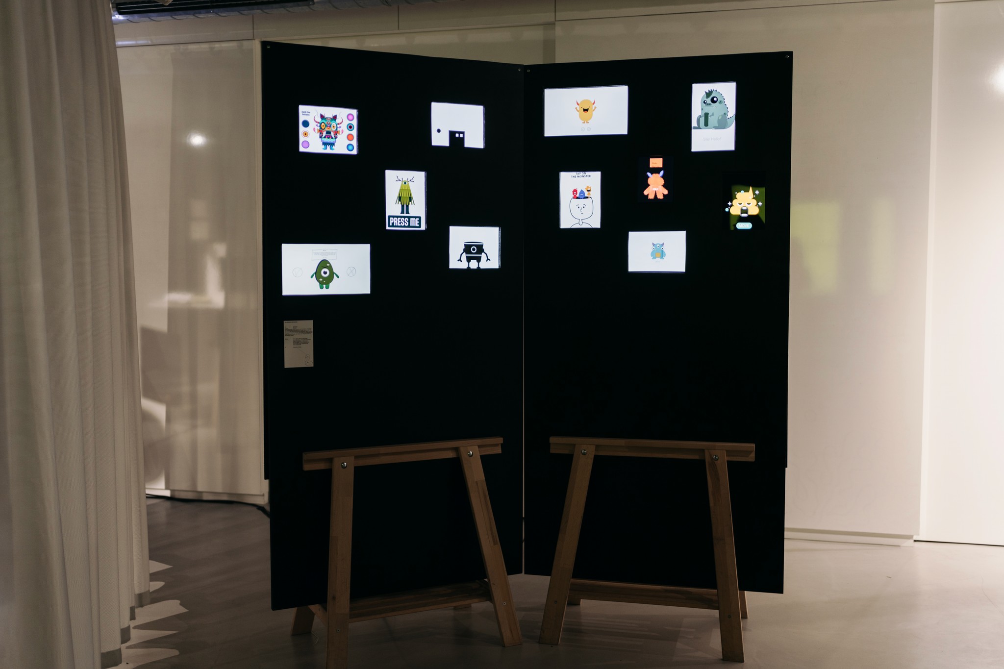 Interaction Wall during the exhibition which shows 11 ipads with interactive monsters