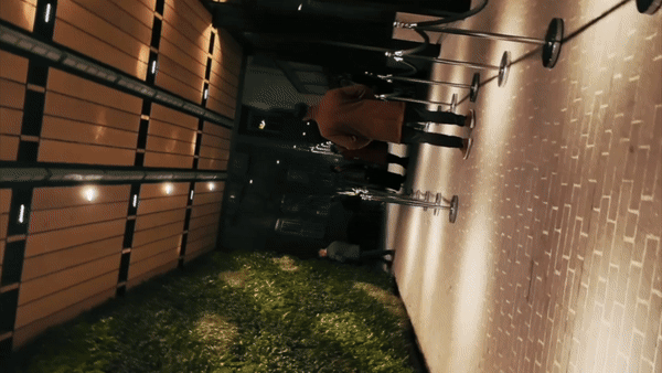 Dancer in black outfit with one leg raised behind