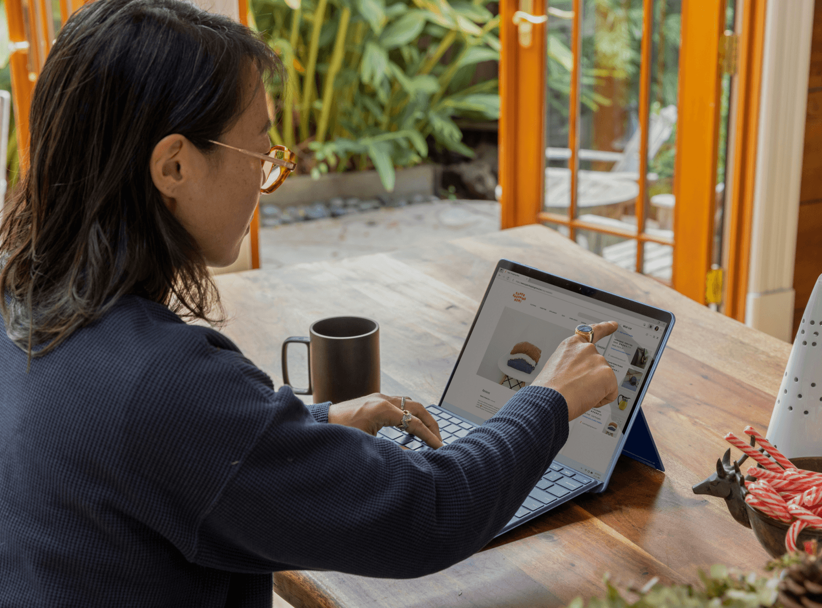 Woman shopping online on a laptop at home