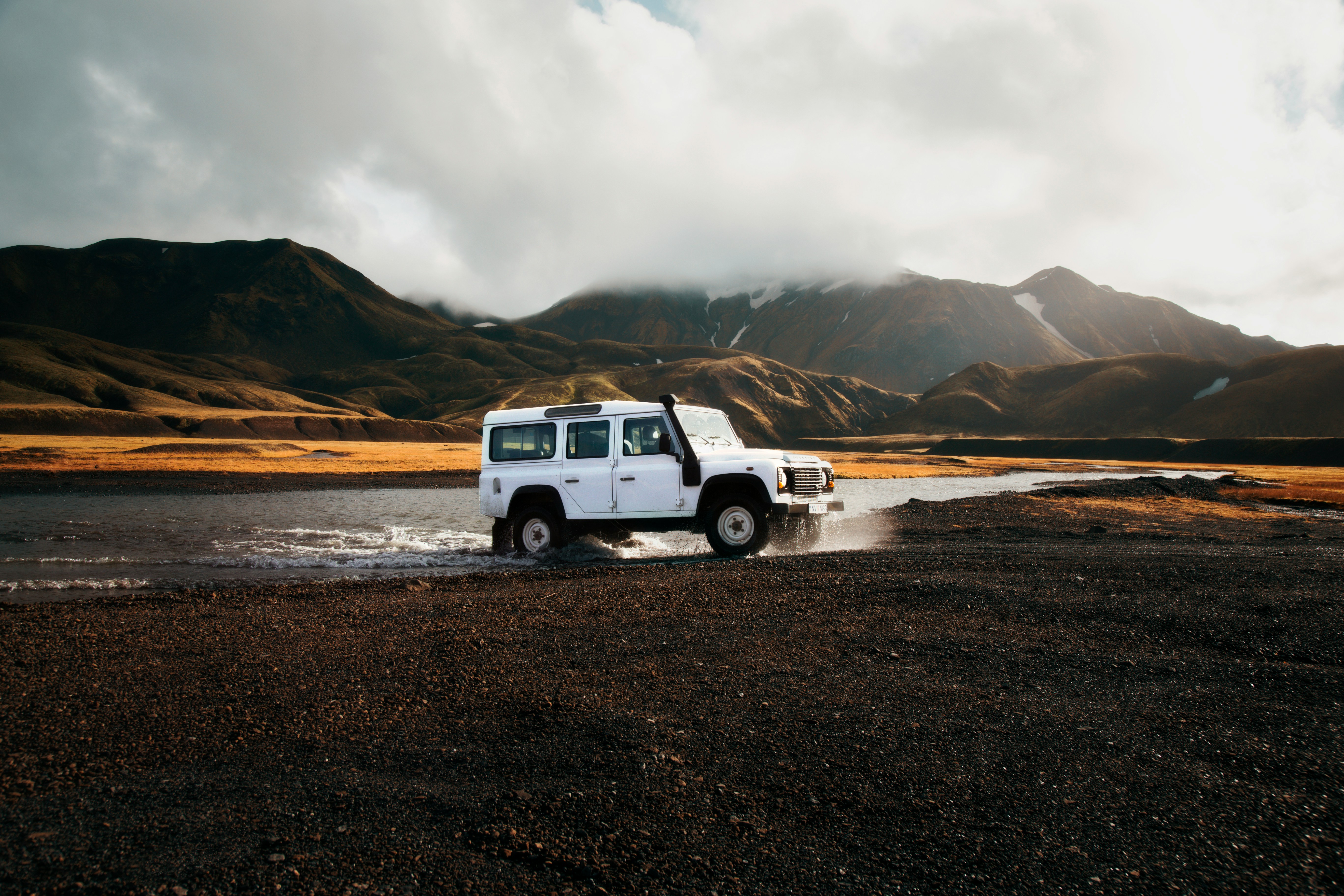 Car crossing a river in the Icelandic Highlands.