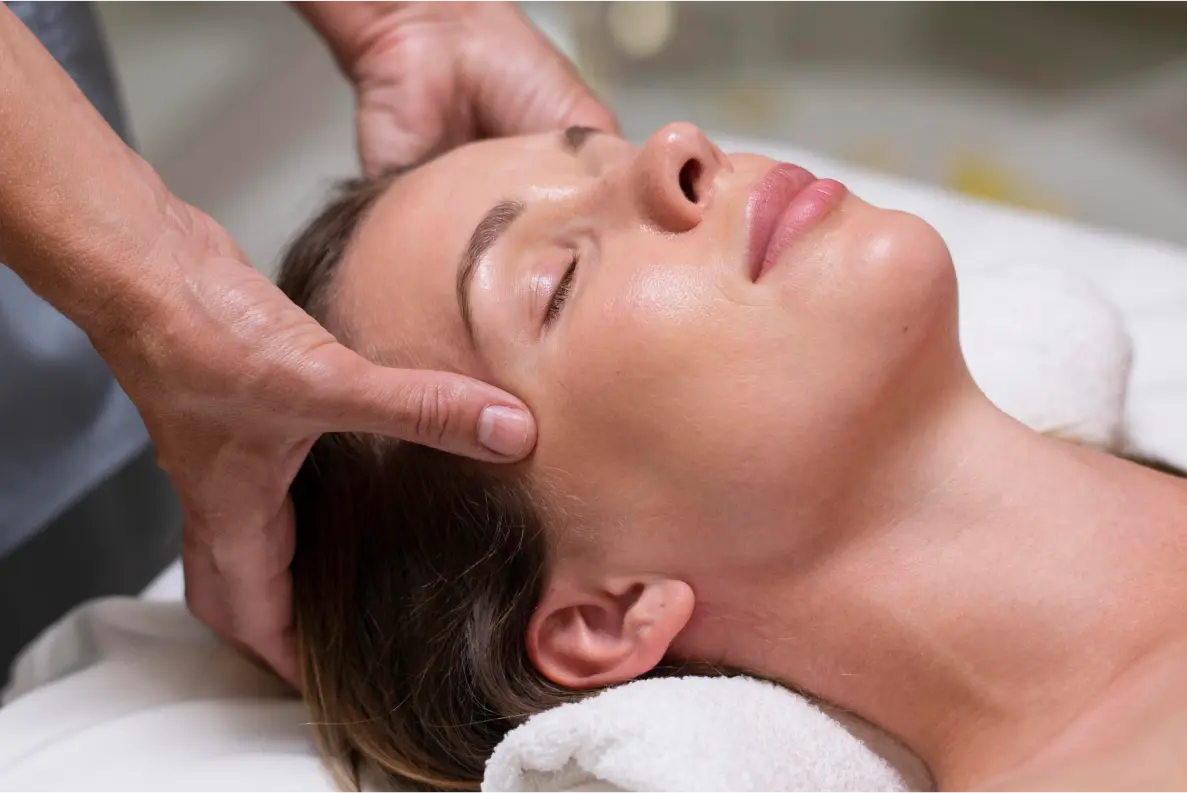 a woman getting a back massage in a spa