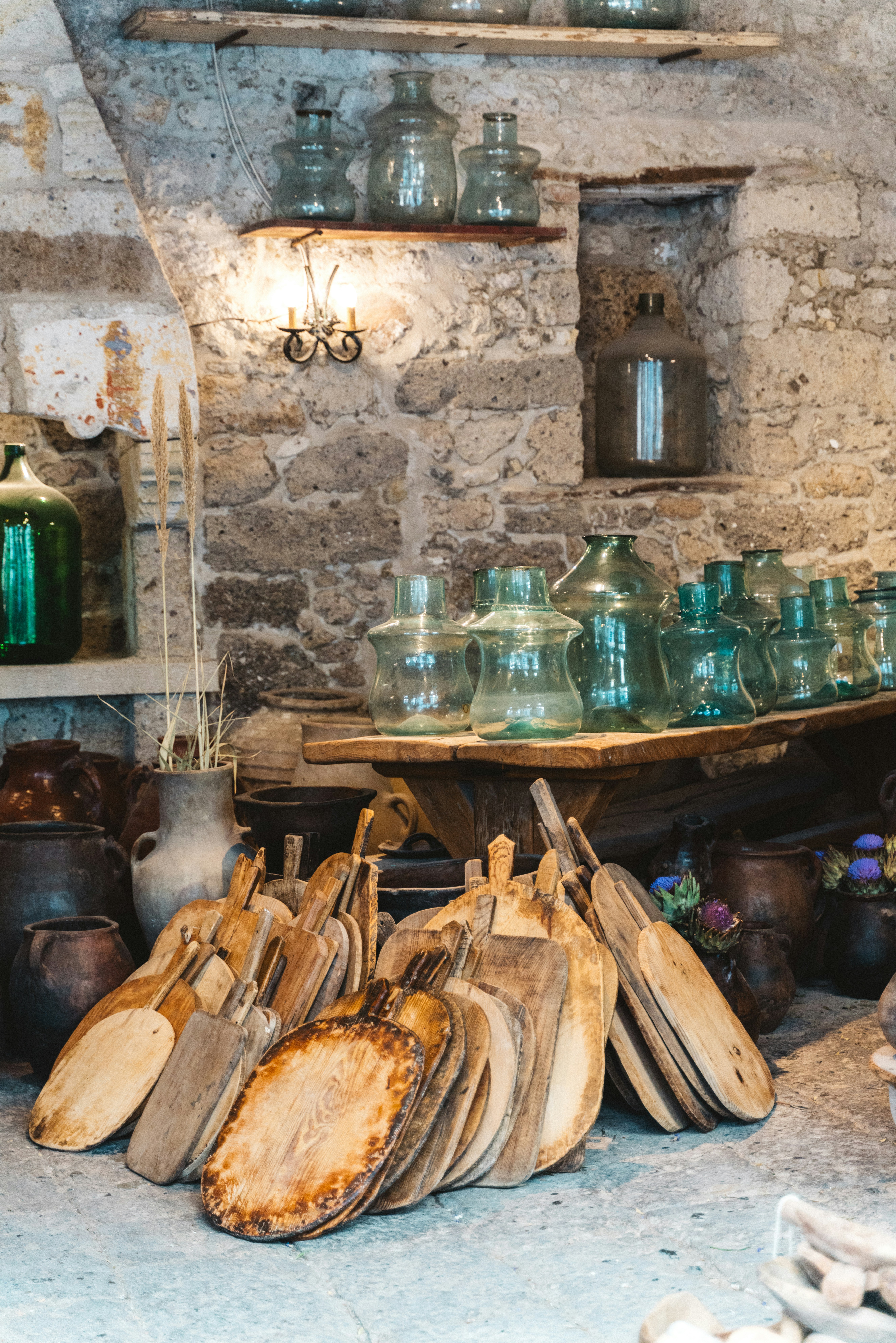 a table topped with lots of wooden utensils
