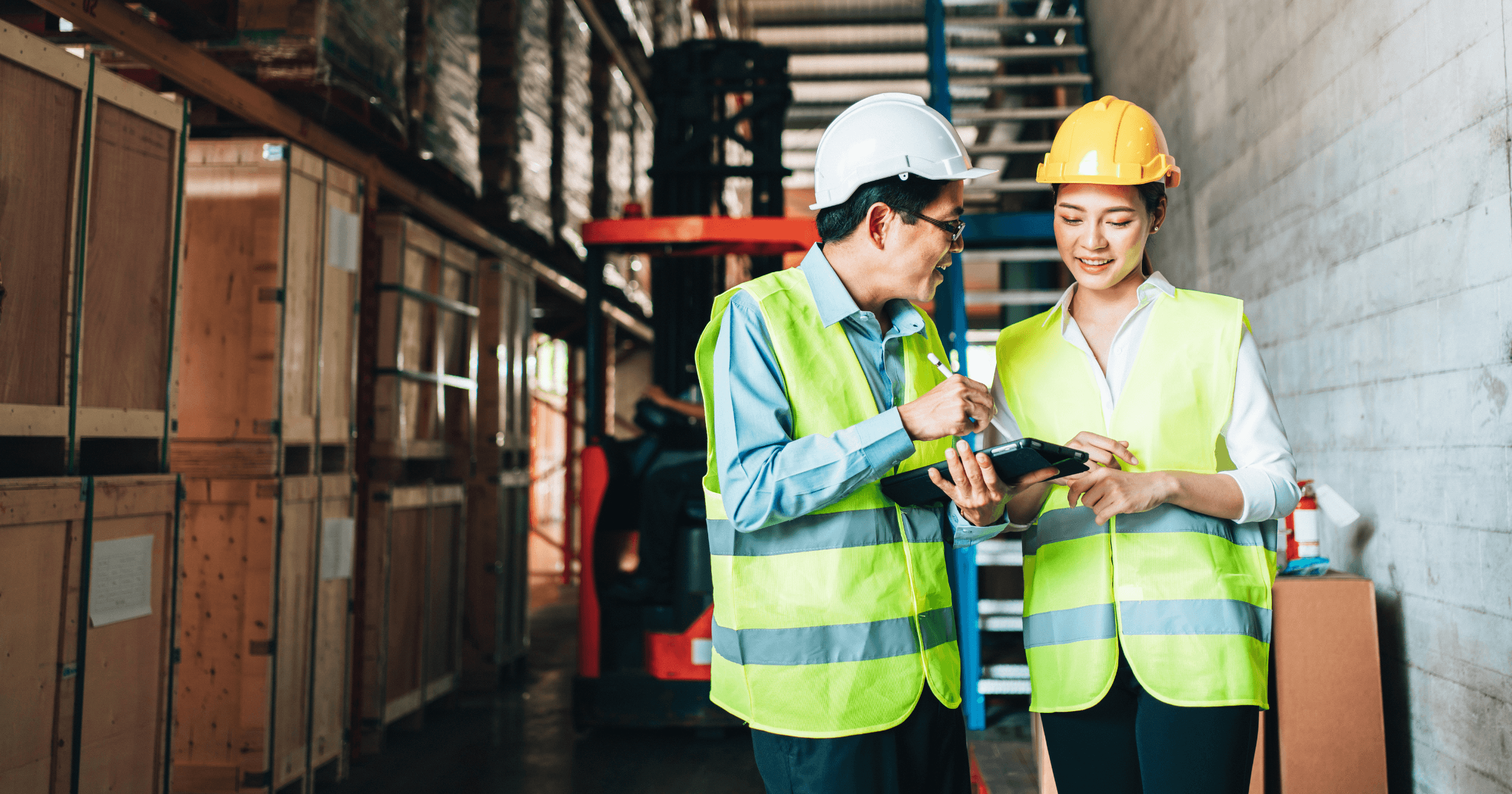 Two people managing a warehouse's inventory