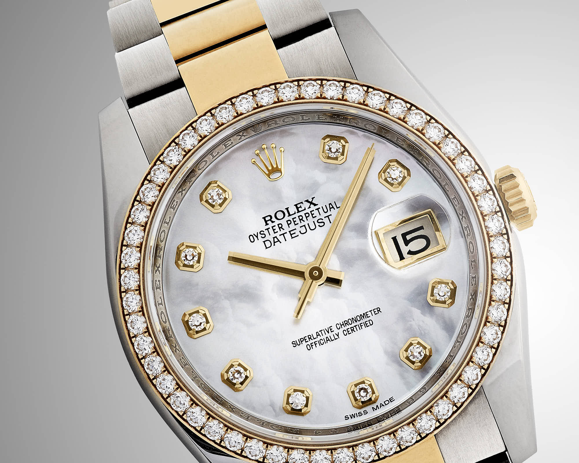 Luxury Rolex Datejust watch with diamond bezel and gold accents.