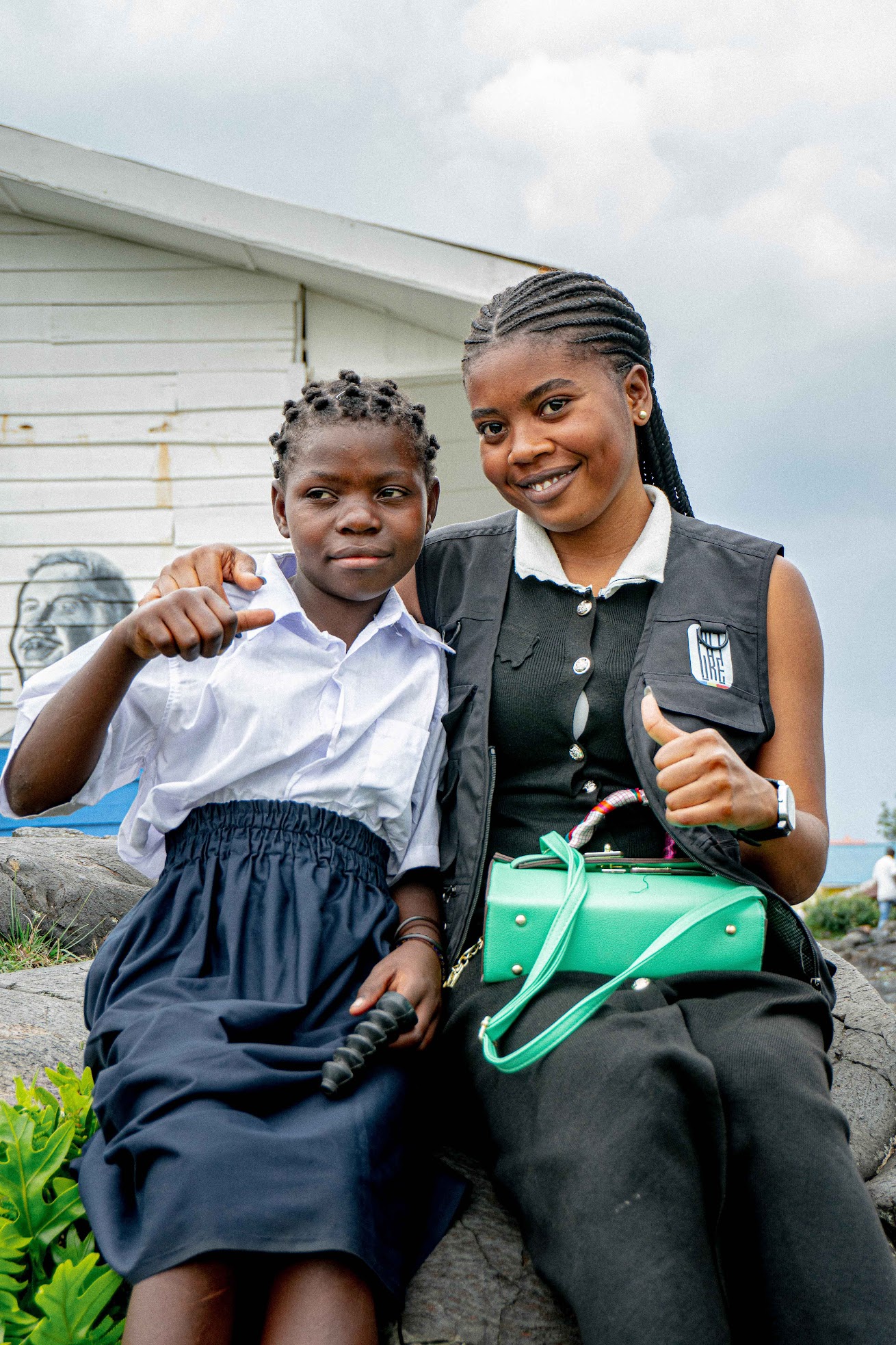 children sitting on chairs inside classroom