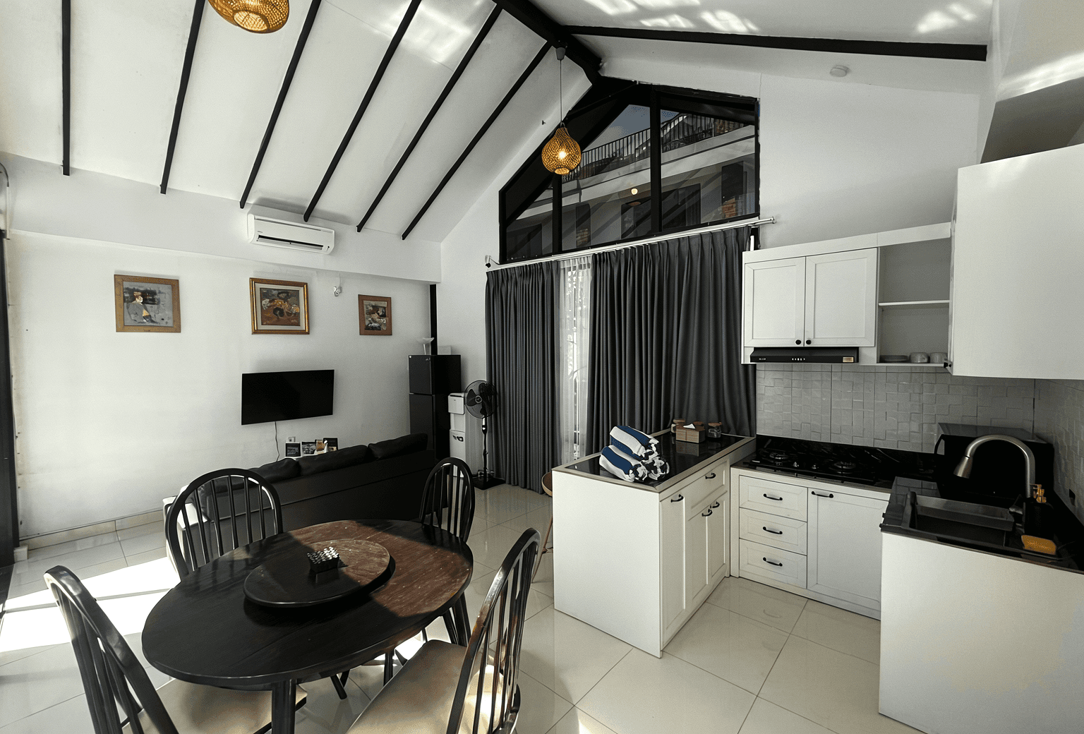 Modern kitchen and dining area at Nyanyi Beach. Our real estate agent helps you find the best Bali properties.
