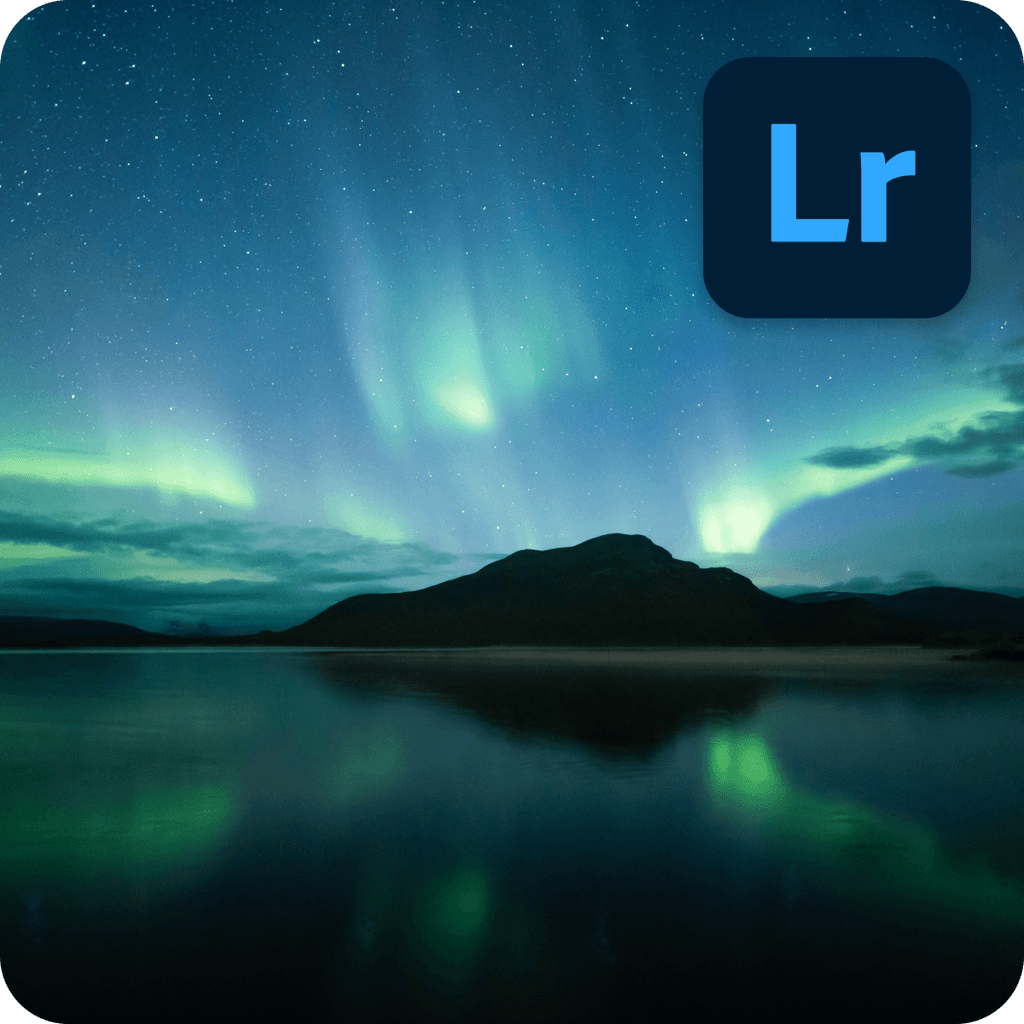 The aurora borealis glowing over a dark mountain with reflections on a still lake