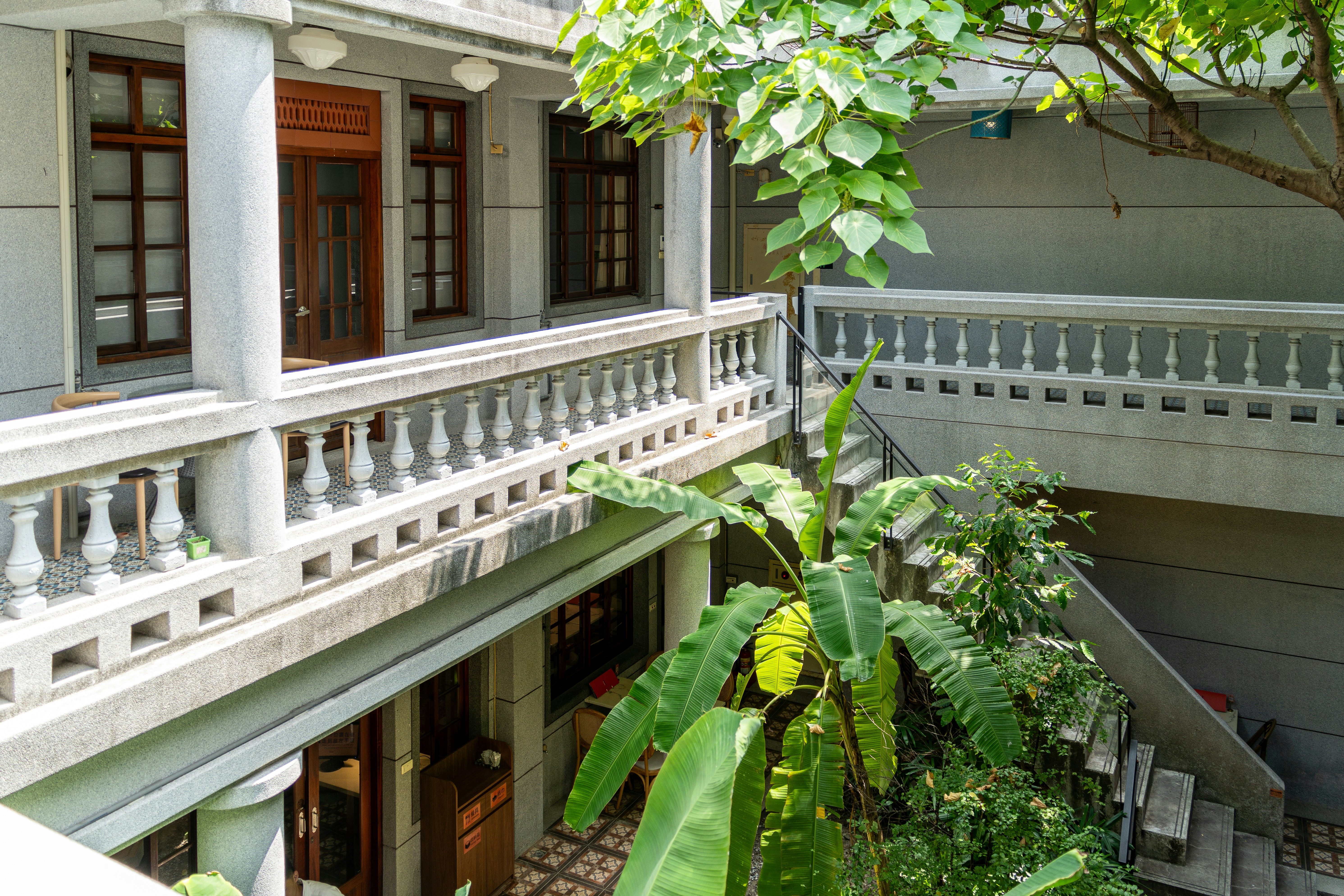 Courtyard with balconies and lush green plants