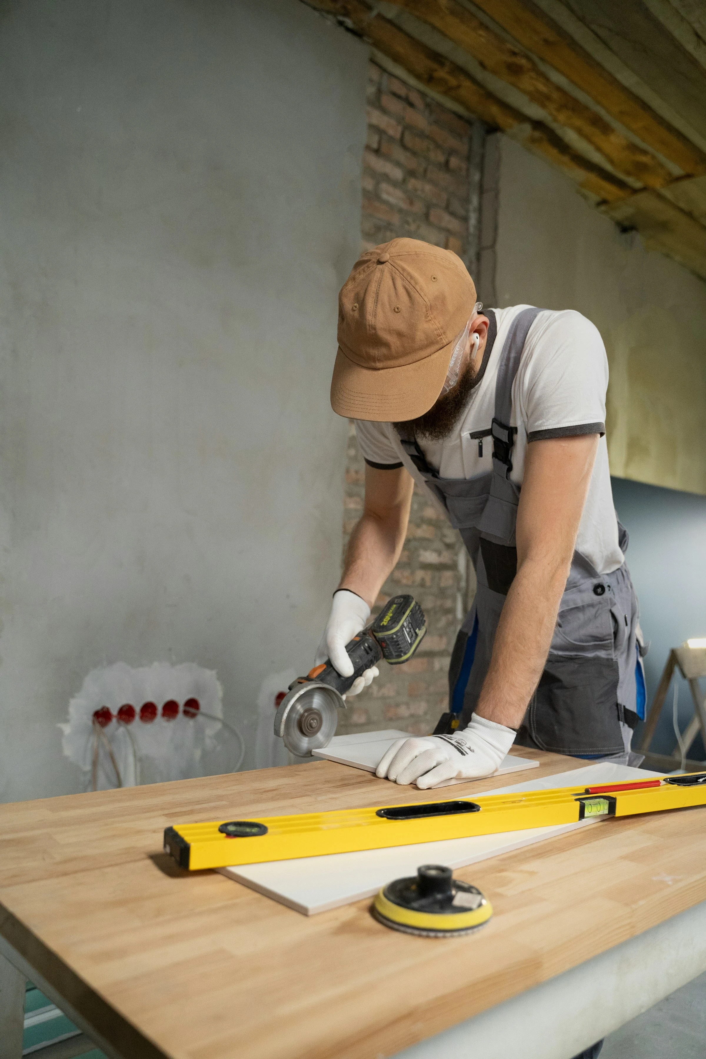 Carpenter measuring and marking wood during interior renovation work