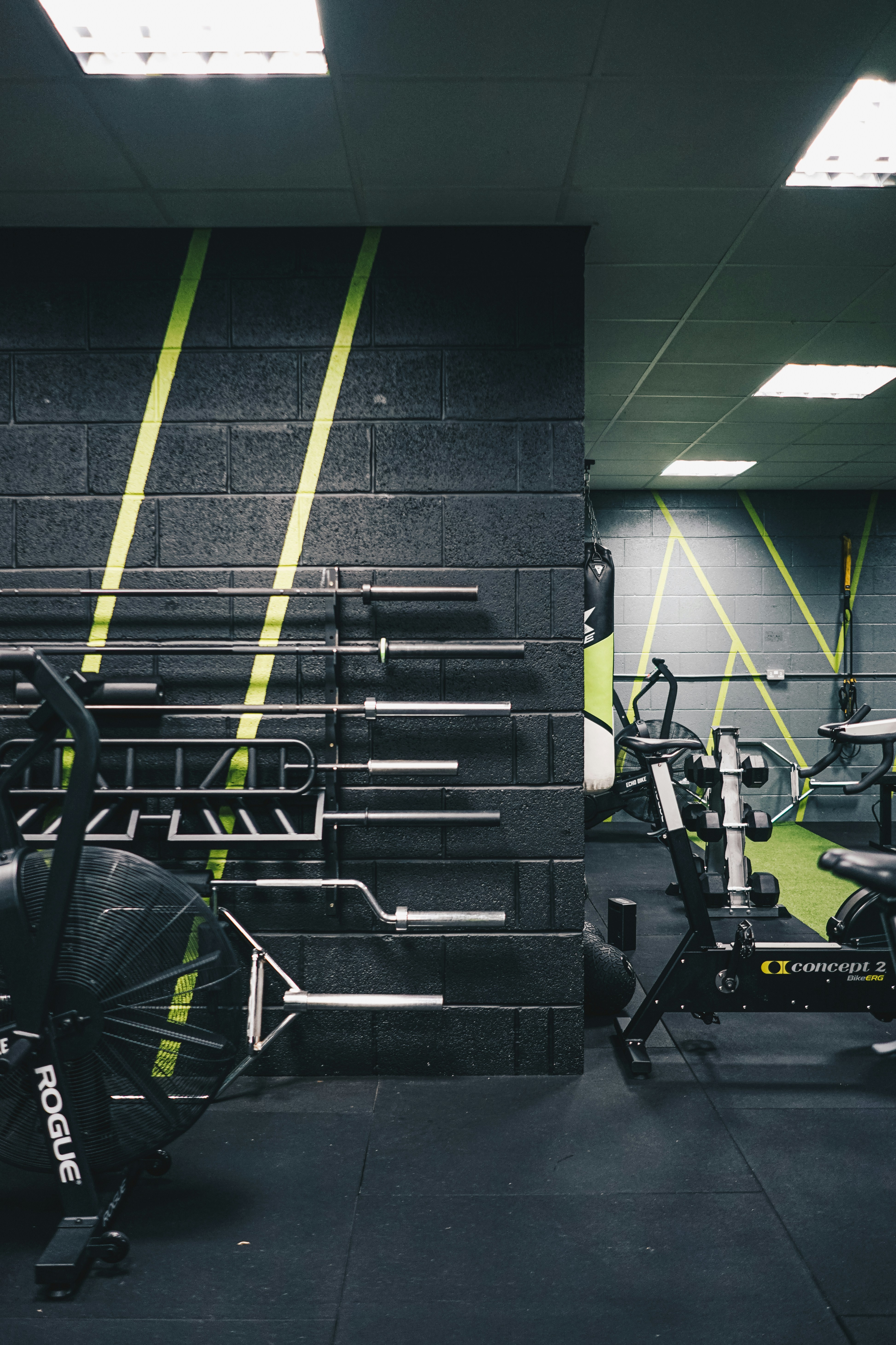 a gym with a row of exercise bikes