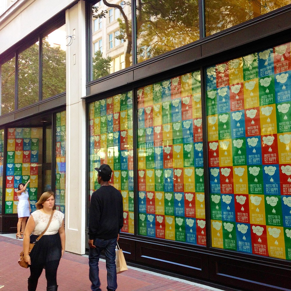 A stack of yellow Amazon delivery boxes with Despicable Me advertising on them with Minons in various of poses.