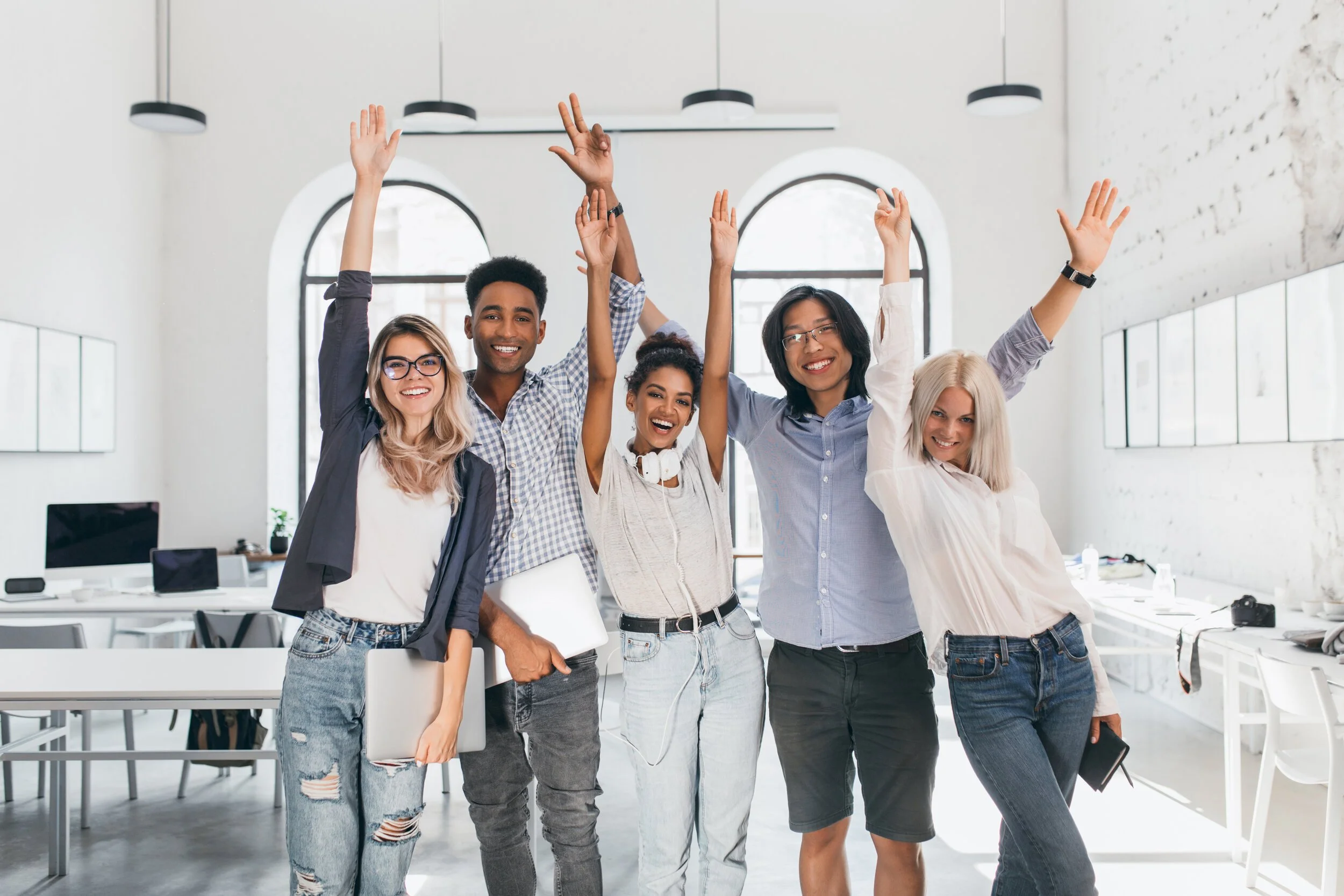 Employees With Their Hands raised