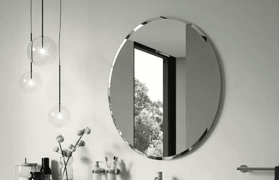 man wearing gray polo shirt beside dry-erase board