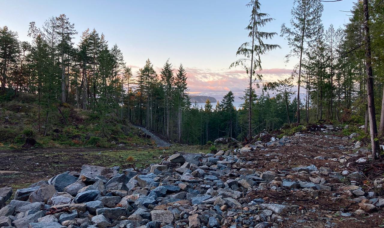 Rock drainage work and site preparation during Wood Bay Heights subdivision road construction