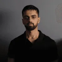 Man in black shirt with beard