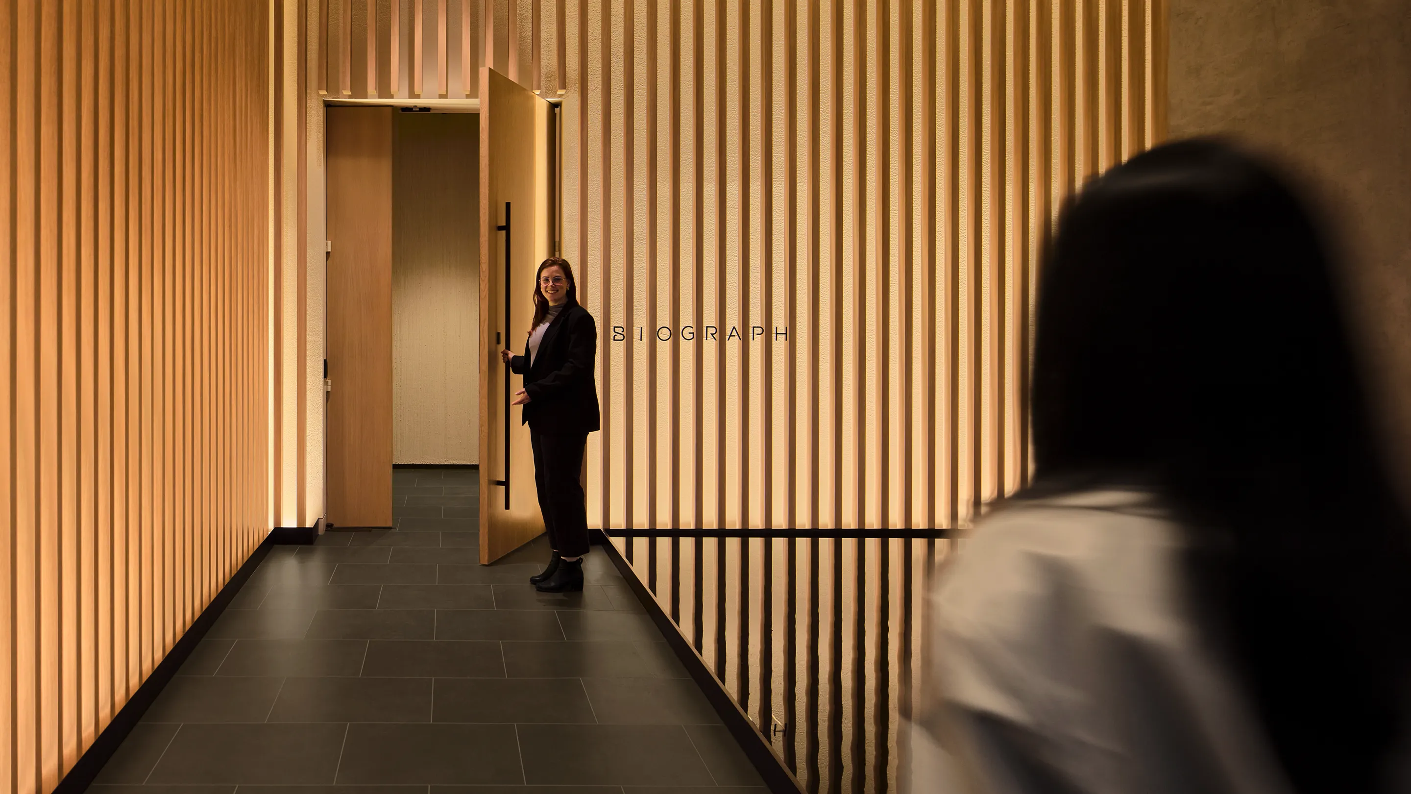 Woman arriving for her Biograph comprehensive preventive health screening results with a physician in a women's health clinic.