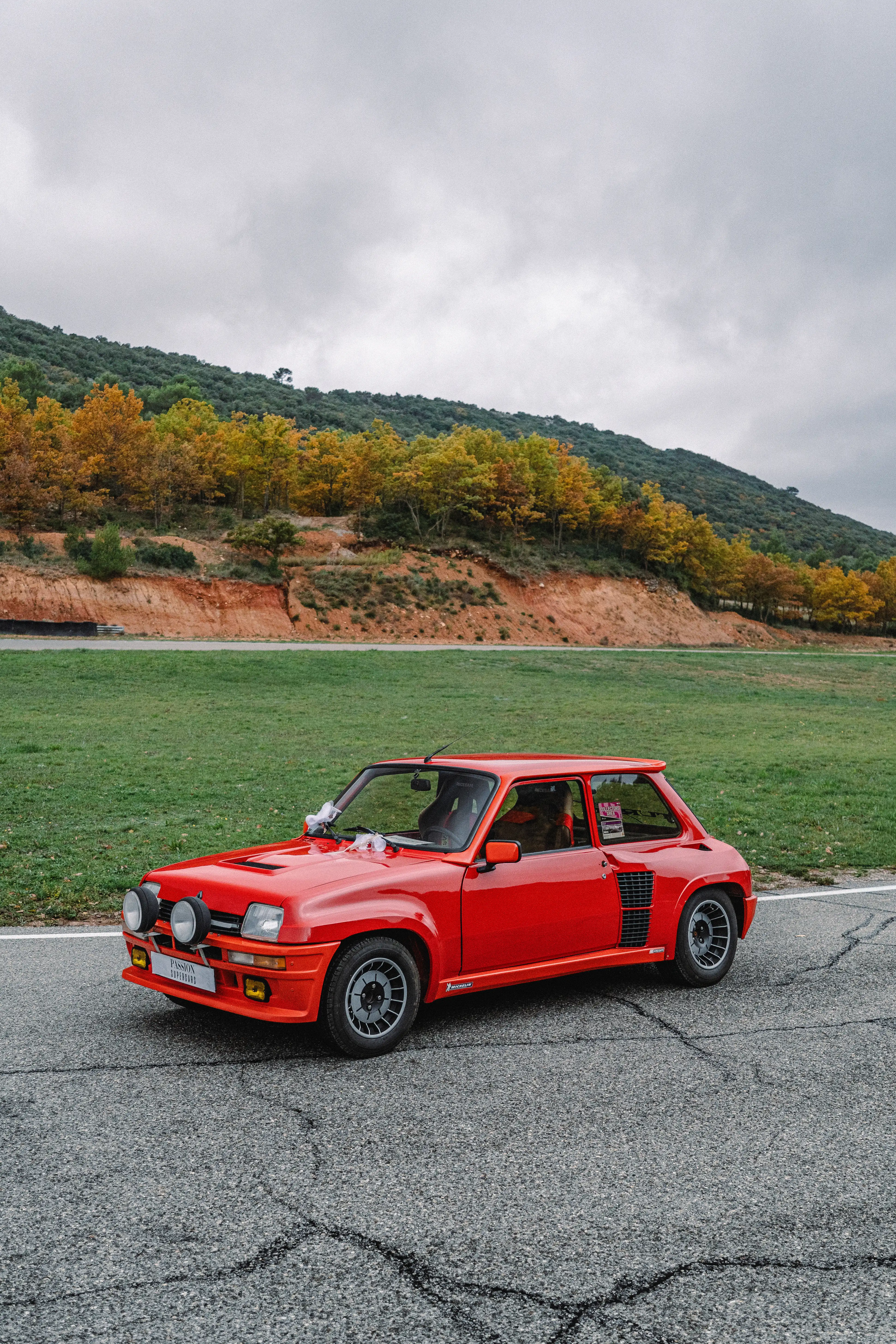A woman in a colorful attire with a colorful background