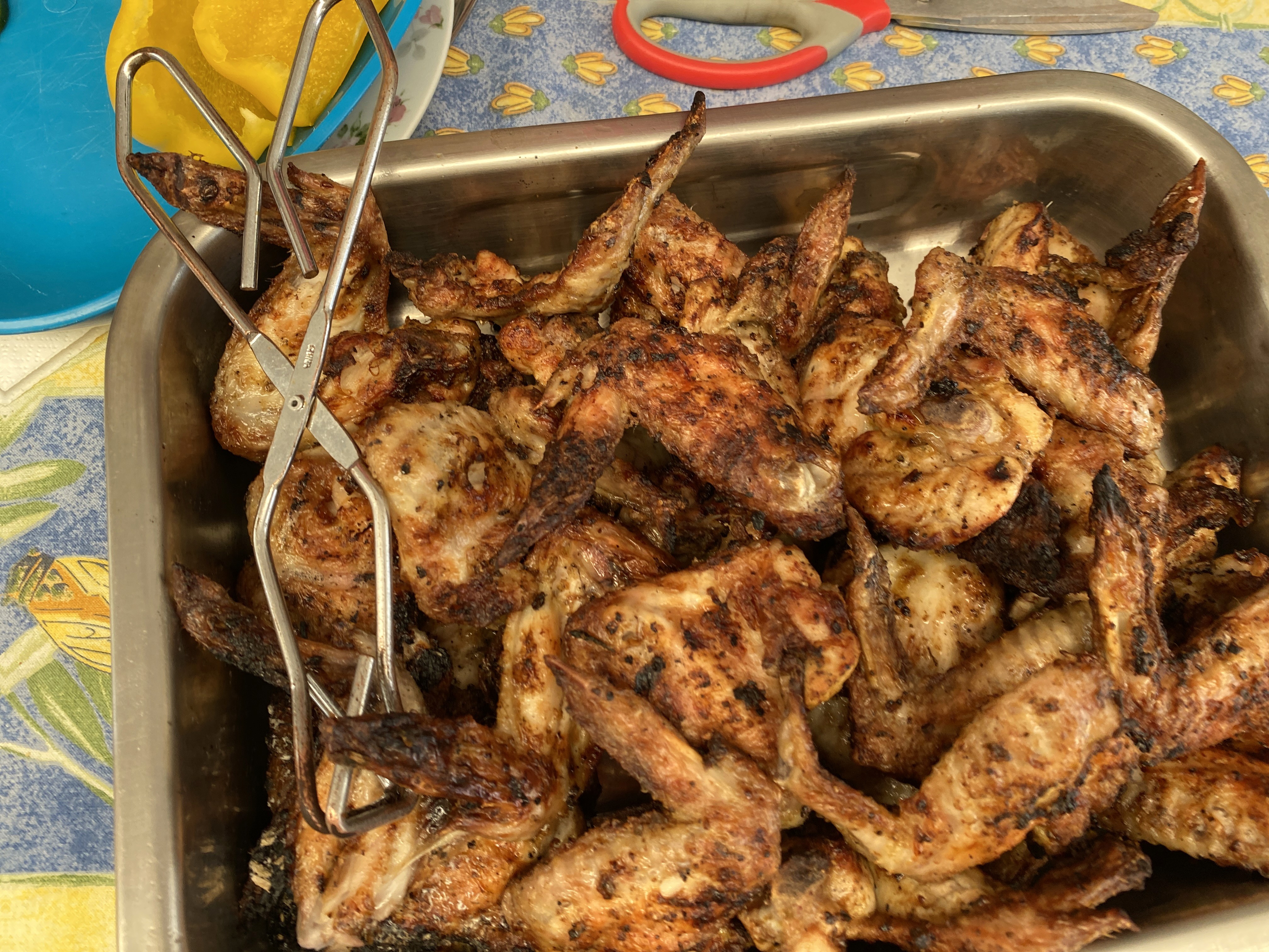 Barbecued chicken wings fresh off the braai in a stainless steel dish at Somerset View Guest House.