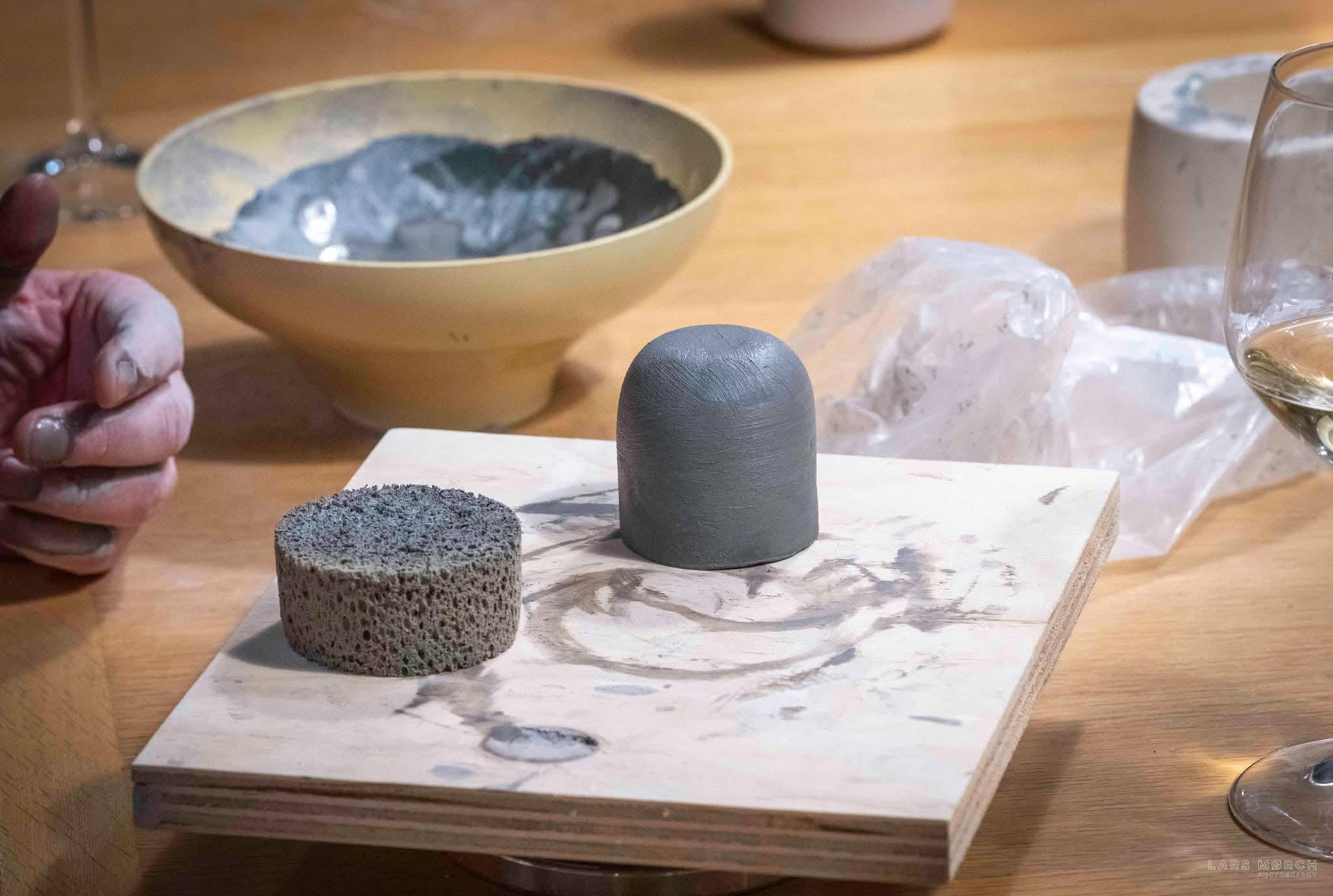 smoothening clay using a wet sponge