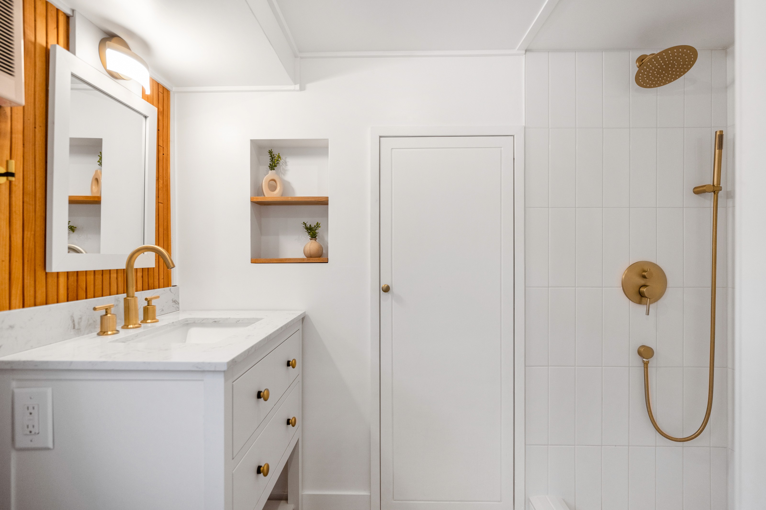 Green kitchen cabinetry with natural wood island and ample countertop space in a St. George Utah home remodel