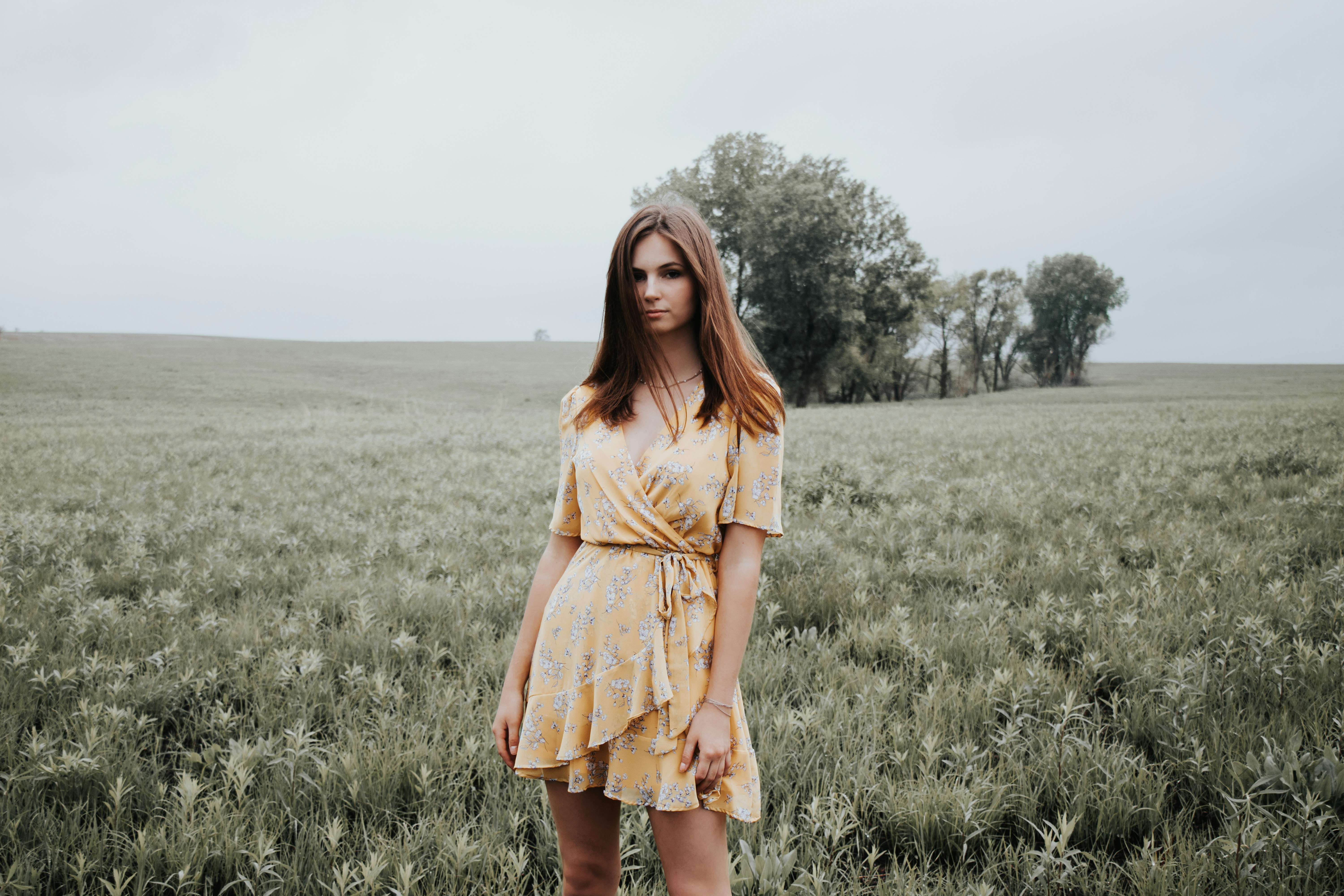 A Girl Standing In Field- Fall Senior Picture Outfits