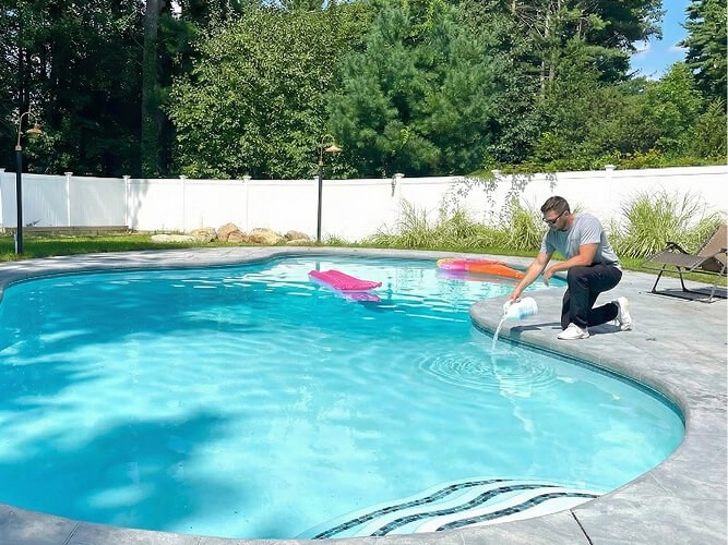 PoolGenx Adding Chemicals To A Pool