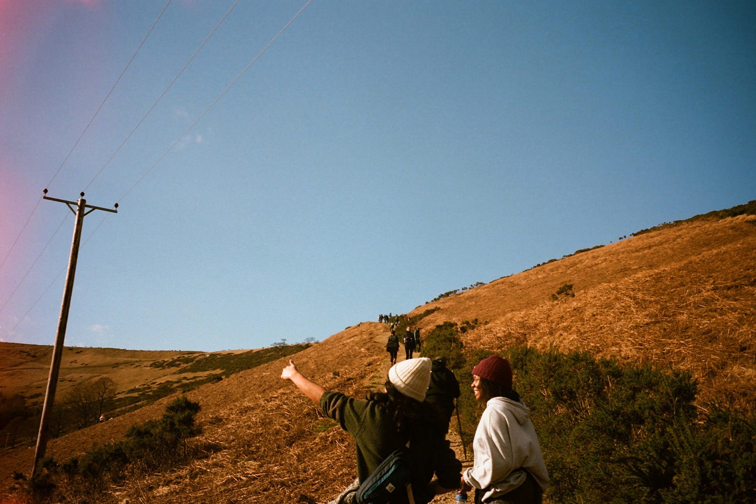 Blue skies overhead, trecking up a steep path