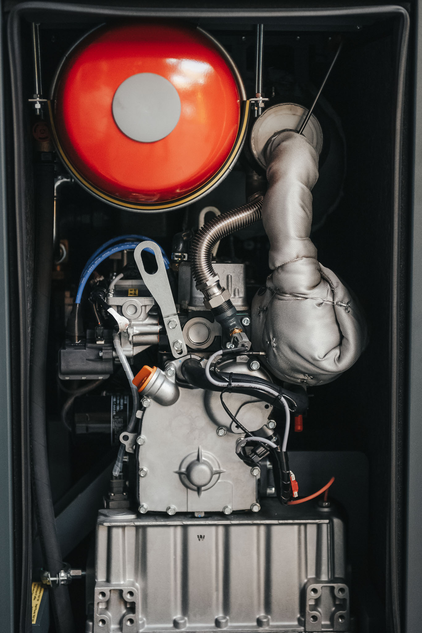 White outline of a classic smiley face followed by the text “Smiley Co” in white serif type on a vivid orange background.