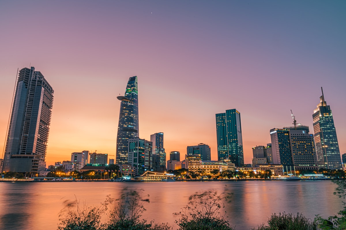 Ho Chi Minh City skyline reflecting on the Saigon River at sunset