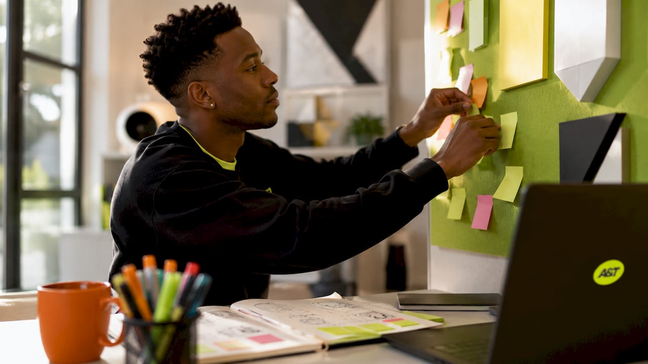Designer planning ad UX with notes and sketches