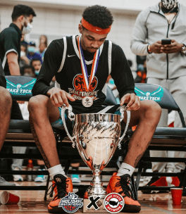 Student with Trophy at 1 Year Post Grad Basketball Program