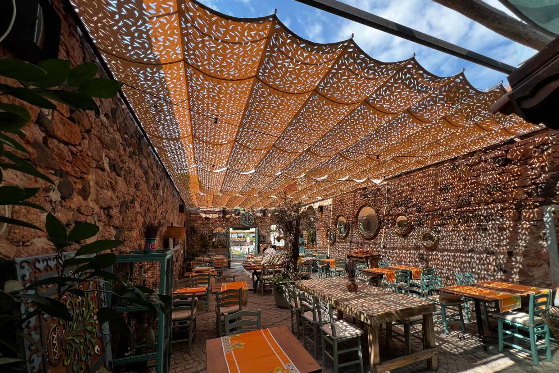 woman holding a phone and man looking at the phone. both are smiling