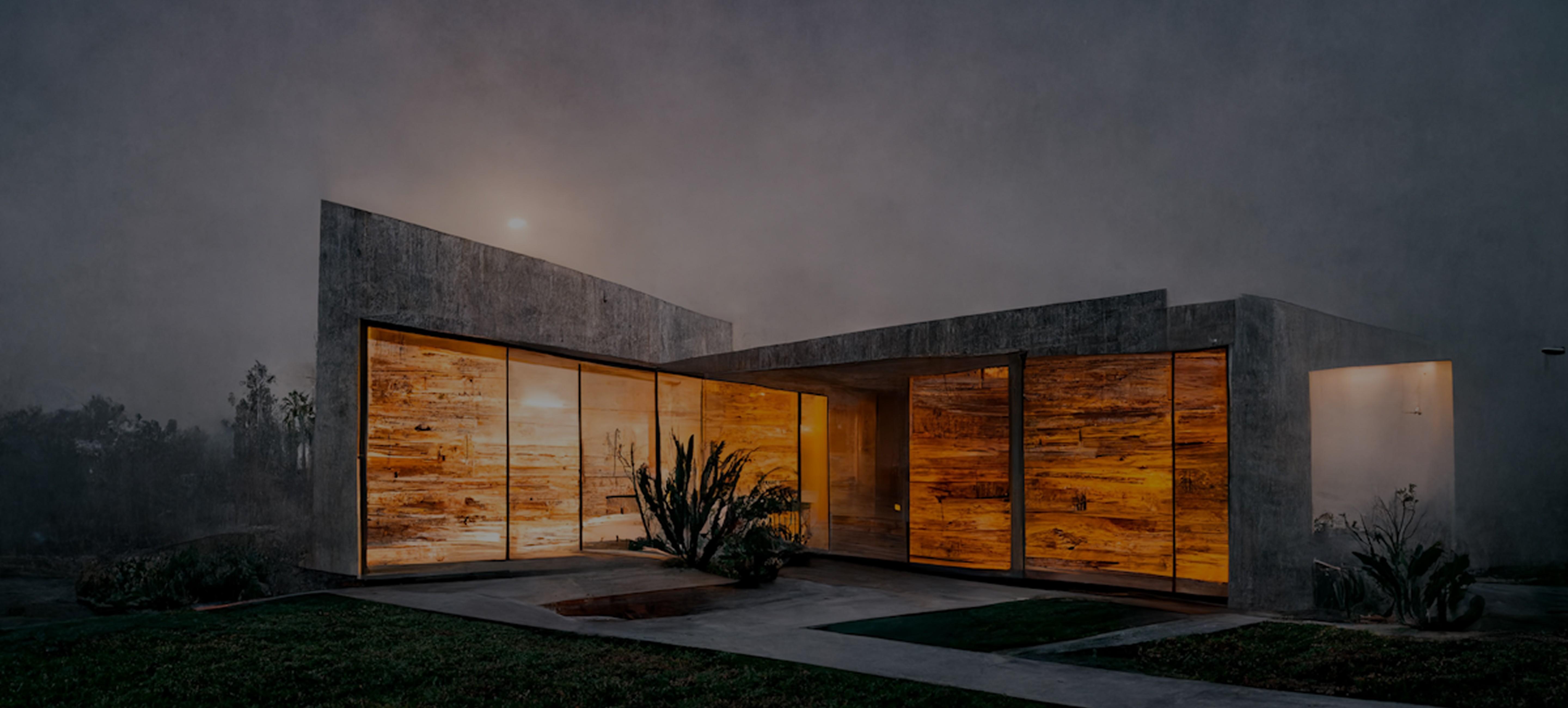 Modern concrete house with orange wood panels. Grass lawn, minimal planting. Overcast sky with faint sun.