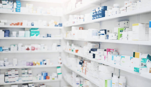 Image of a chemist shelves with differnt medicine packaging on them 