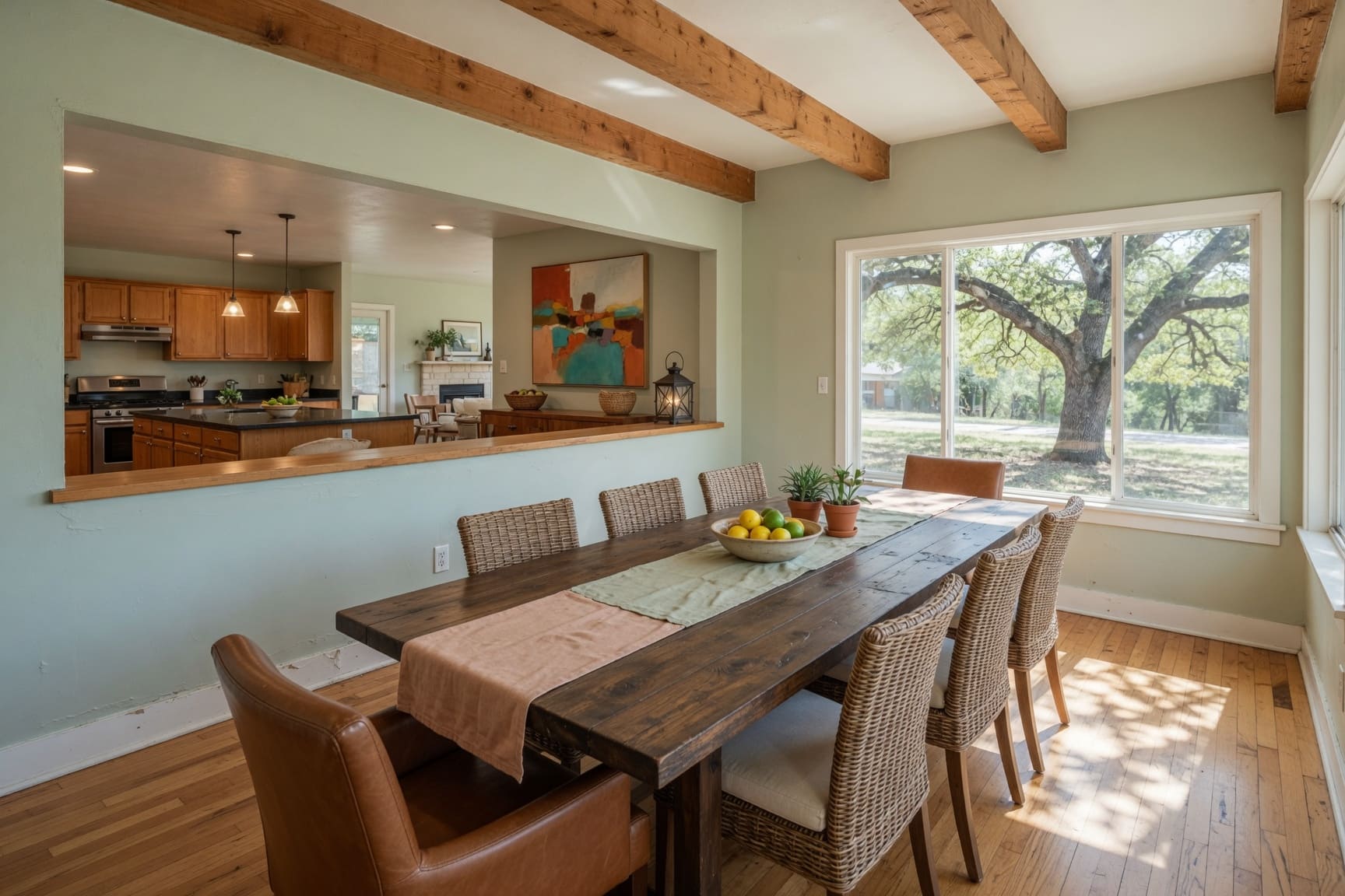 Dining room with reclaimed wood table and garden views
